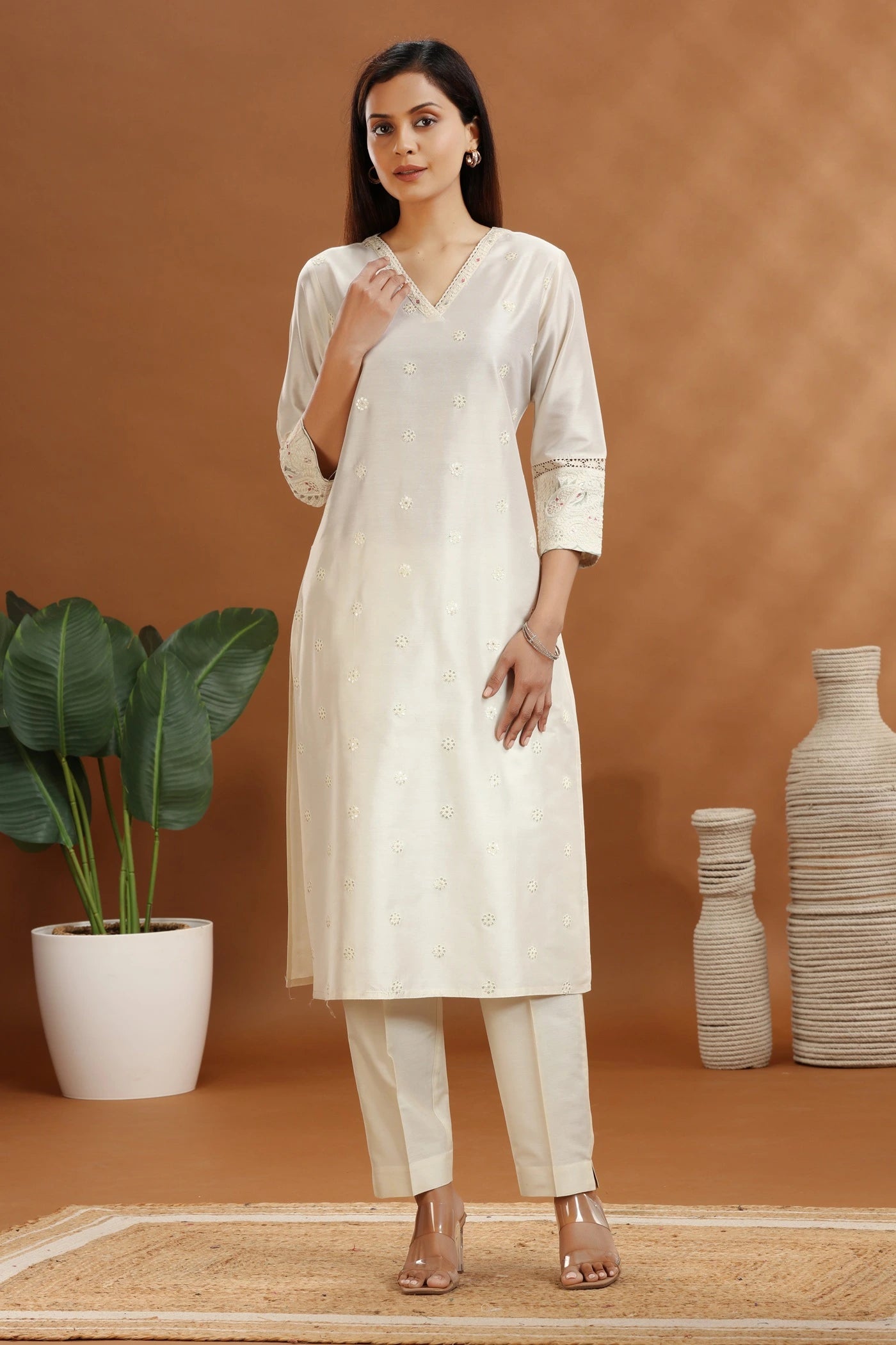 Off white cotton chanderi straight kurta set with all-over pink and green floral hand block print.