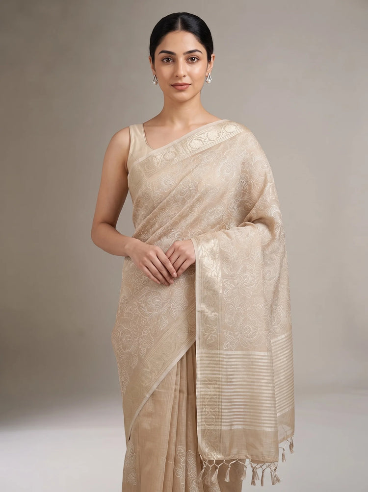 Close-up front view of elegant beige linen woven saree showing its woven texture