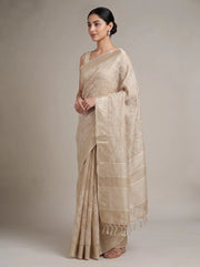 Left side view of elegant beige linen woven saree showing the saree drape