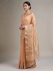 Side view of orange Kota tissue woven border saree showing the graceful drape and detailed woven border
