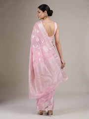Back view of elegant pink cotton woven saree showing the blouse, saree drape and traditional woven border