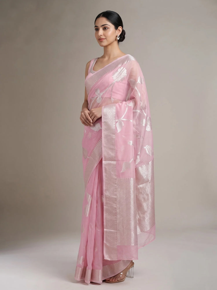 Side view of elegant pink cotton woven saree showing the graceful drape, woven pattern and decorative border
