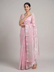 Front view of elegant pink cotton woven saree with the model’s right hand near her chest, highlighting the woven design and border
