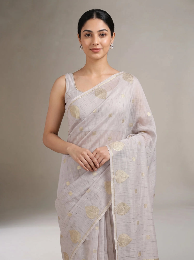 Close-up front view of lilac purple cotton zari stripe saree showing the golden zari stripes and fabric texture