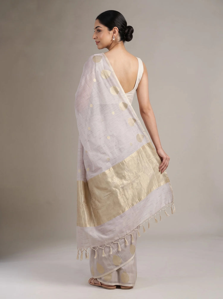 Back view of lilac purple cotton zari stripe saree showing the blouse, striped drape and golden zari detailing