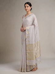 Side view of lilac purple cotton zari stripe saree showing the graceful drape, zari stripes and decorative border