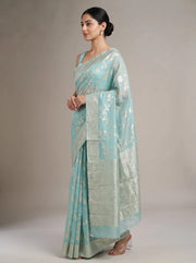 Left side view of the sky blue Saffee cotton woven saree showing its side drape and fit