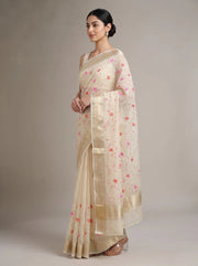 Side view of cream Munga Kota cotton Banarasi embroidered saree showing the flowing drape, embroidered details and ornate border