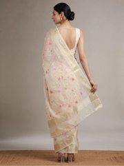 Back view of cream Munga Kota cotton Banarasi embroidered saree showing the elegant drape, floral motifs and decorative border