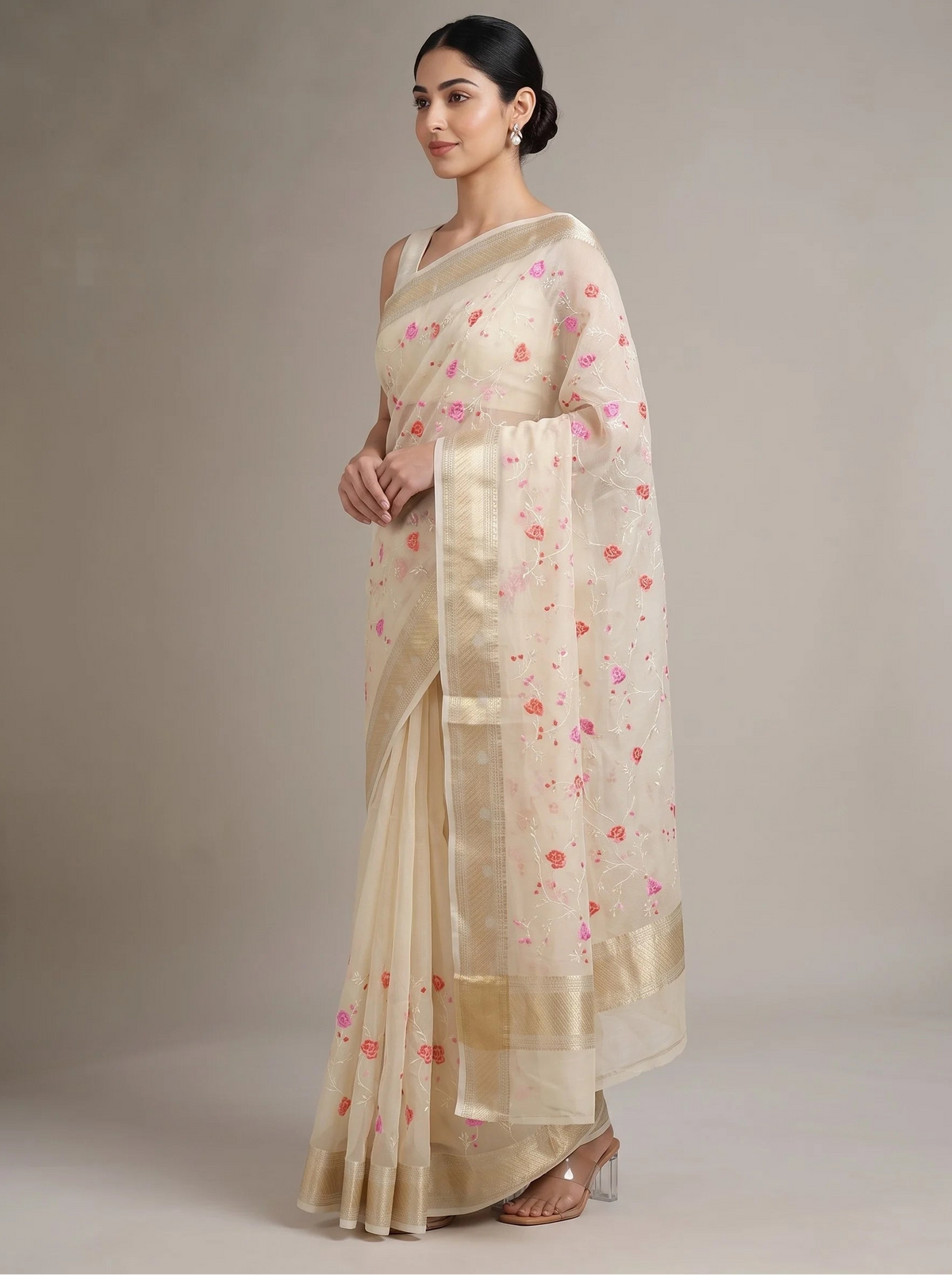 Side view of cream Munga Kota cotton Banarasi embroidered saree showing the flowing drape, embroidered details and ornate border