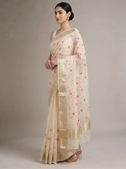 Side view of cream Munga Kota cotton Banarasi embroidered saree showing the flowing drape, embroidered details and ornate border