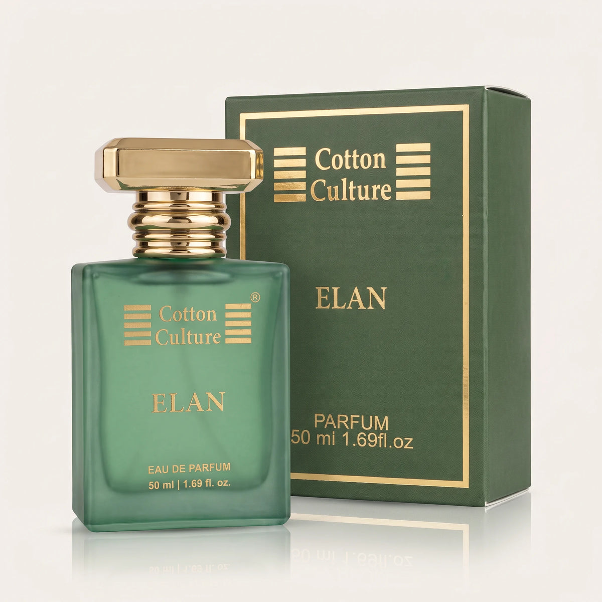 A green glass perfume bottle with a gold cap stands in front of its matching green and gold box. The bottle and box are labeled 'Cotton Culture' and 'ELAN PARFUM'.