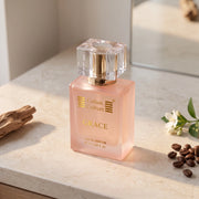 The back of a perfume box for 'Grace' by Global Fragrances Company, featuring a peach-colored background with a gold border and black text detailing ingredients, notes, and usage instructions.