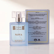 A perfume bottle labeled Cotton Culture NOVA with a light blue body and gold lettering, shown on a white background with the text 'SCENT PROFILE' and 'FRUITY | CITrus | SPICY | WOODY'.
